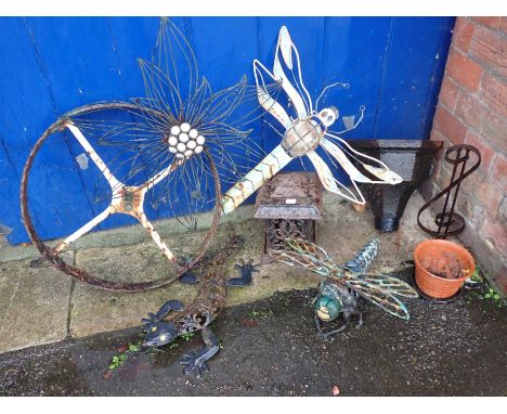 AN IRON GARDEN LANTERN an iron wheel, and other metal garden items