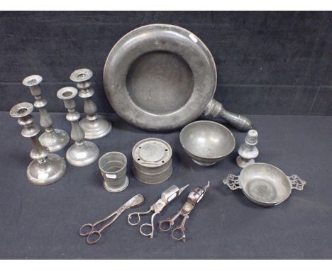 A COLLECTION OF OLD PEWTER including a pair of candlesticks, others (and various steel snuffers), a bed pan, inkwell and othe