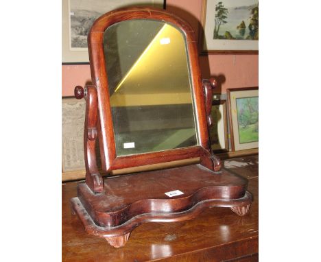 Late 19th Century mahogany swing mirror on stand.