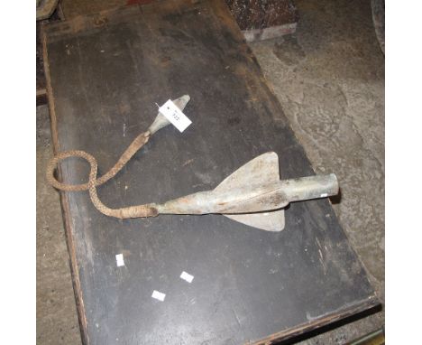 A brass ships log vane with braided cord and brass connector.
