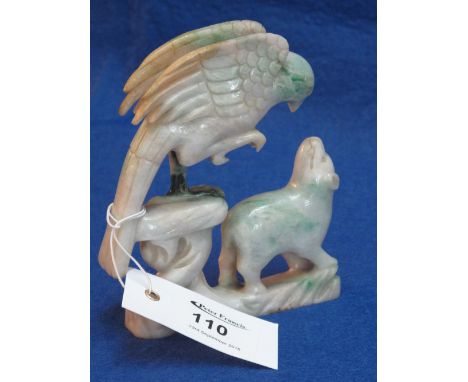 Chinese carved mutton fat jade group in the form of an eagle attacking a dog or lamb. CONDITION REPORT: Restoration or repair