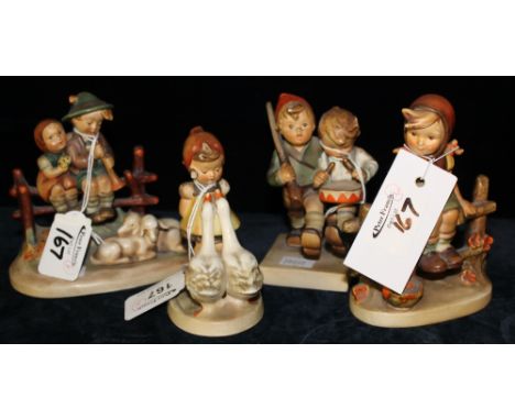 Group of four Goebel Hummel figure groups to include children sitting on fences, girl with geese and drummer boys.  (4)