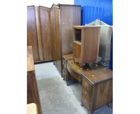 Mid 20th Century walnut bedroom suite comprising wardrobes, mirror back dressing table and bedside cabinet. (4)