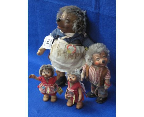 A set of four Steiff hedgehogs, mother, father and two children.  Bearing labels and names.