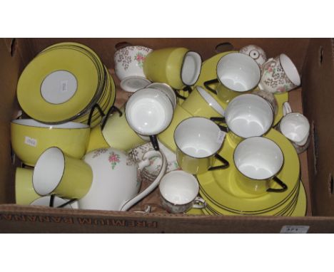 Box of assorted tea ware to include Roslyn fine bone china, gilt and floral design and yellow on black geometric design compr