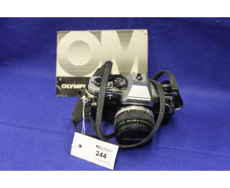 Olympus OM10 camera with 28mm lens and manual.