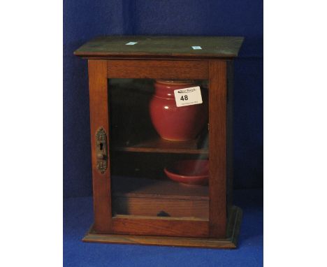 Early 20th Century oak glazed smokers cabinet with ceramic jar and cover, together with mixing dish, shelf and fitted drawer 