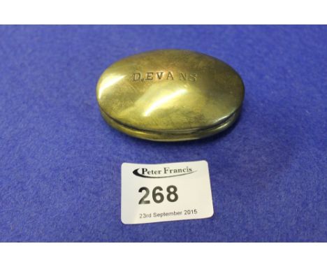 Brass oval snuff box named D Evans.
