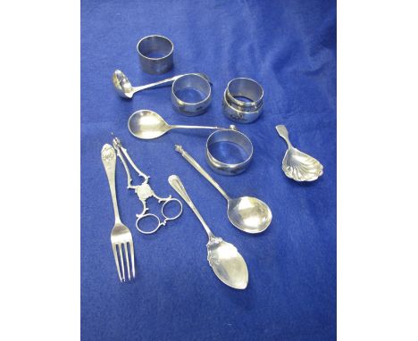 Bag of assorted silver and white metal to include: napkin rings; shell design caddy spoon; flower head spoon marked: 925, ini