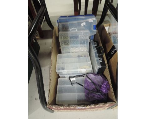 A box containing seven small cases and three medium boxes of jewellery crafters beads including pearls, hematite, quartz, ame