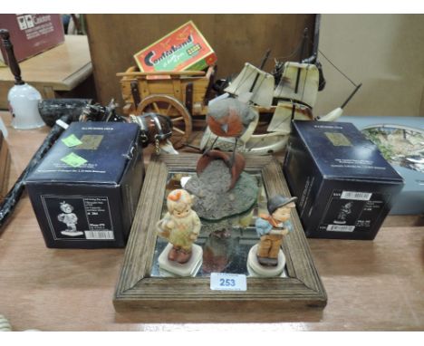 A selection of figures and figurines including Hummel