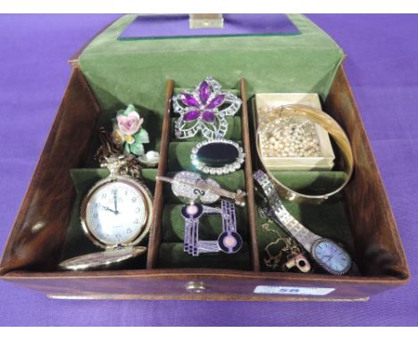 A small jewellery box containing a selection of costume jewellery including brooches, Pulsar watch, bangle etc