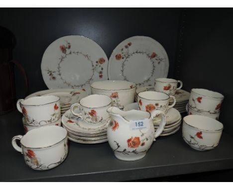 A part tea or coffee service by Doulton Burslem with raised and printed design