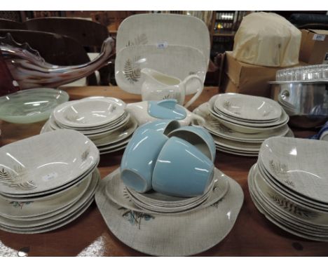 A part tea and dinner service by Meakin in a vintage pattern