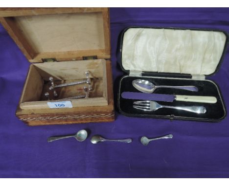 A cased child's cutlery set including HM silver spoon and fork, and a leather coated box containing silver plated knife rests