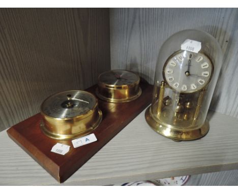 A clock and barometer set with anniversary clock