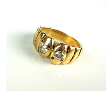 A diamond and ruby entwined stylised snake ring, designed as two entwined snakes with brilliant cut diamond set head and face