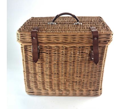 A Swaine Adeney Brigg &amp; Sons, 'Coracle' wicker hamper, with leather handle and straps, the lid with ivorine label 'Coracl