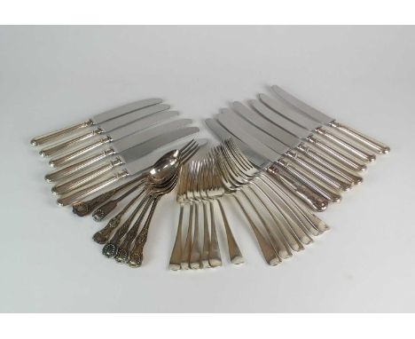 A collection of silver cutlery, comprising; a set of six silver table forks and six silver dessert forks, Mappin &amp; Webb, 