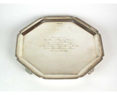 A silver presentation salver, Walker &amp; Hall, Sheffield 1949, of octagonal form with gadrooned rim, engraved to the centre