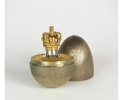 An Elizabeth II silver gilt limited edition surprise egg by Stuart Devlin, London 1977, no. 118, the textured body opening to