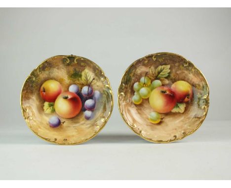 A pair of Royal Worcester pin dishes decorated with still lives of fruit by P. Robertsdated 1959, artist signed, black printe