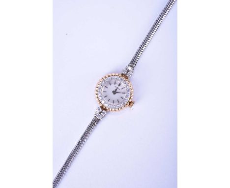 Vertex: A lady's diamond-set bi-metal watchDate: Circa 1955Movement: 17-jewel, manual windDial: Silver, baton hour markers, s