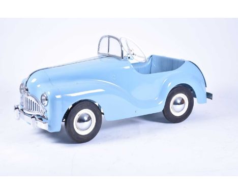 A Tri-ang Centurion pedal car, circa mid-1950s, in pale blue livery with chrome trim, electric headlights and tail light, the