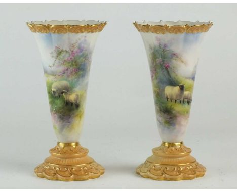 A pair of Royal Worcester vases painted by Harry Davisdated 1911of flared form, decorated with sheep grazing in a grassy land