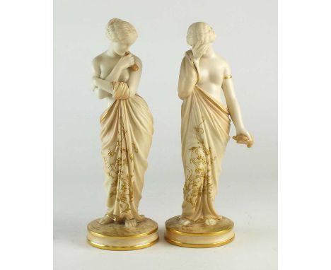 A pair of Royal Worcester blush ivory figures of Joy and Sorrowdate marks rubbed, with gilt details to the their robes, print