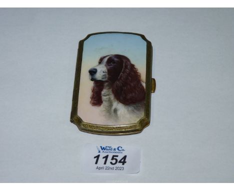 A gilt metal Card Case having an enamel top depicting a hand painted portrait of an English Spaniel, stamped 'gold case', the