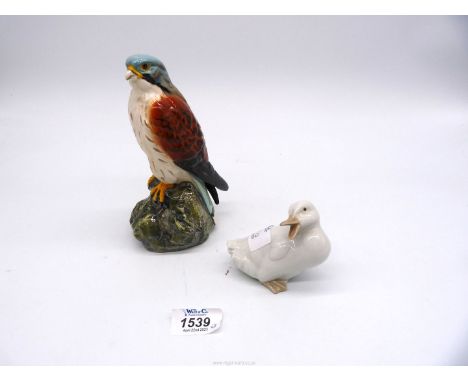 A Royal Doulton 1979 Scotch Whisky Kestrel decanter (empty) and a Nao duck.