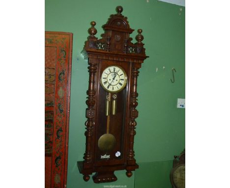 A Mahogany and Walnut cased Gustav Becker Vienna type Wall CLock having a two train weight-driven movement striking the hours
