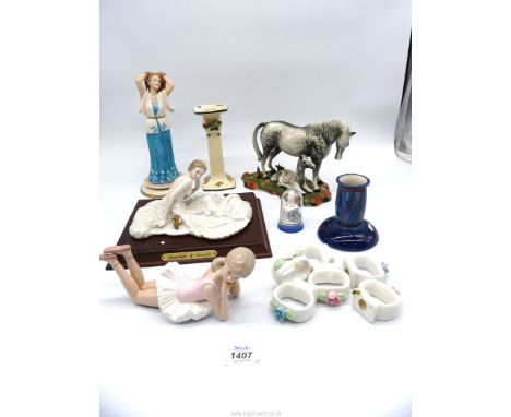 A quantity of china figures including Leonardo ballerina, horse on plinth (base loose), napkin rings, Royal Doulton candlesti