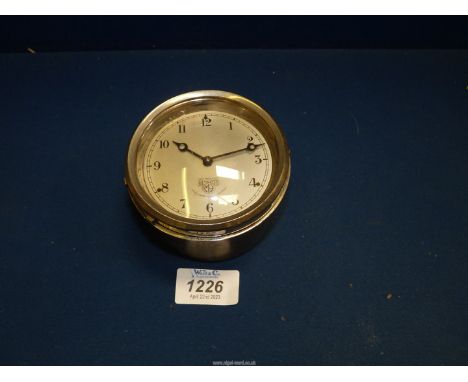 A Smith's hinge out to wind and set car dashboard clock, no. 519452, having silvered face with Arabic numerals, not running, 