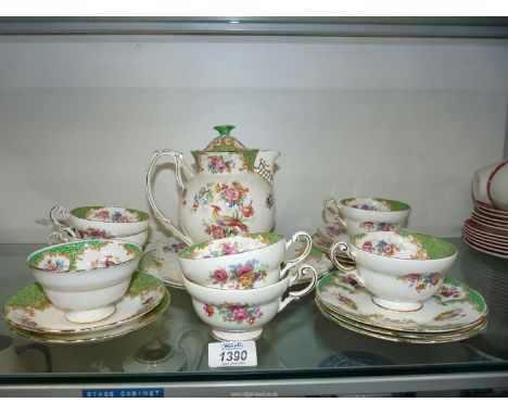 A part Paragon Rockingham tea set consisting of hot water jug, six cups, two small saucers, one large saucer, three tea plate