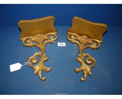 A pair of gilt wood Wall bracket shelves with scroll decoration to lower section, 8" wide x 4" deep x 10 1/4" high.