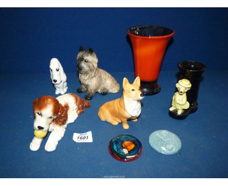 A quantity of Sylvac china including orange vase, Corgi dog, Spaniel chewing a ball and two pottery plaques, (one by Poole).