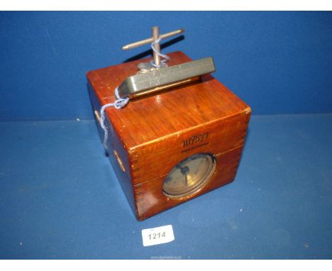 An Oak cased "Easy-Way" Clock No. 107571 made in Germany, the lockable case 7'' x 6'' x 6'' high, having viewing windows (run