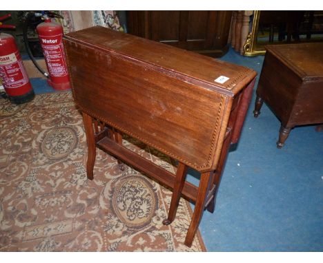 A Mahogany Sutherland Table having light and darkwood rope stringing to the top and raised on lightwood strung shaped square 