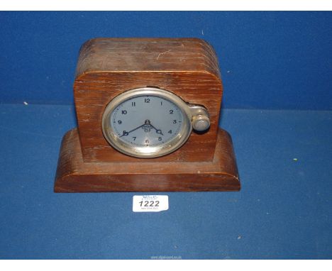 A Smiths car Dash-board Clock having front facing knurled winding/setting knob between the 2 &amp; 3 o'clock position, the 3'