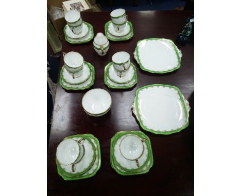 ROSYLN TEA SERVICE, with floral and gilt decoration, comprising 12 trios, sugar, cream and 2 side plates