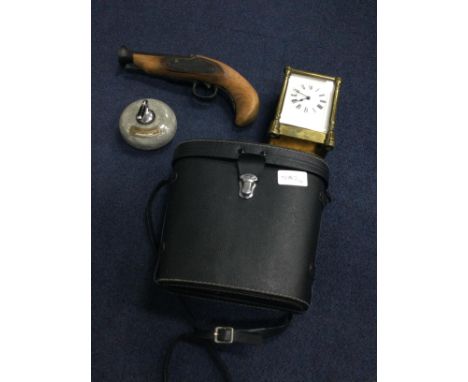 BRASS CARRIAGE CLOCK, along with a pair of binoculars in fitted case, a novelty pistol and a paperweight modelled as a curlin