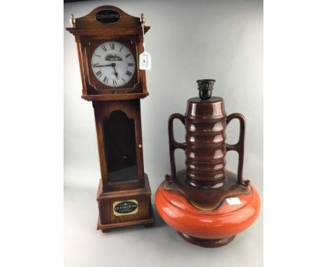 LARGE GERMAN POTTERY TABLE LAMP, along with a Glengoyne whisky display case modelled in the form of a grandfather clock, also