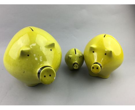 GRADUATED SET OF THREE PIG COIN BANKS, the largest 22cm high, along with a porcupine quill box, Japanese doll and ceramic jar