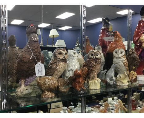 SIXTEEN BENEAGLES ANIMAL WHISKY DECANTERS, including Merlin, Osprey, Buzzard, Badger and Seal decanters. Along with a Famous 