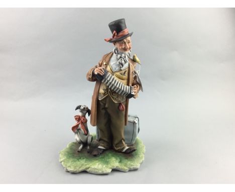 CAPODIMONTE FIGURE OF A MAN PLAYING THE ACCORDION, 32cm high