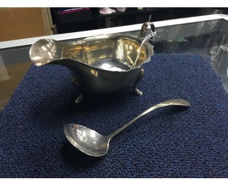 SILVER SAUCEBOAT BY EMILE VINER, along with a silver sauce ladle (2)