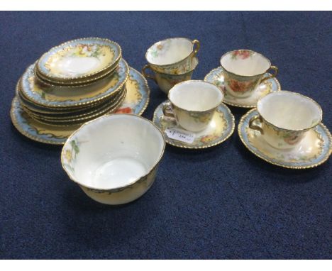 NAUTILUS PORCELAIN PART TEA SERVICE, comprising five teacups, six saucers, six plates, one serving plate and one sugar bowl, 