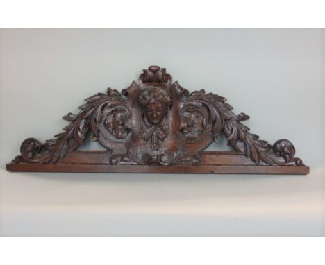 Victorian carved oak panel, the central female mask within an acanthus moulded frame, 100cm long